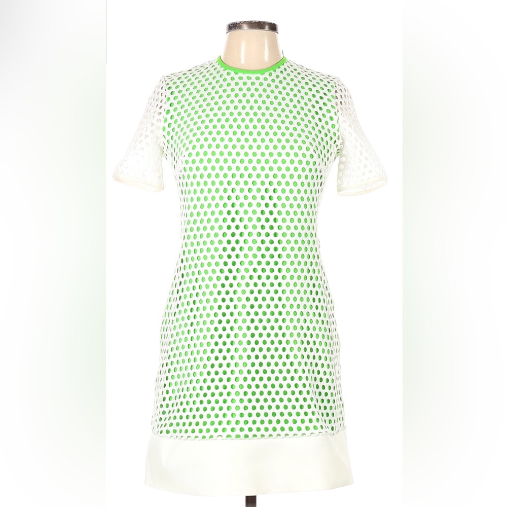 Green and white dress. Back is open with white circles. 100% wool